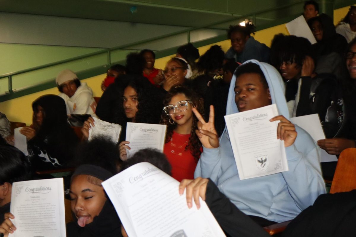 Students receiving official acceptance letters during the House Draft.